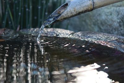 Close-up of bamboo spout pouring water