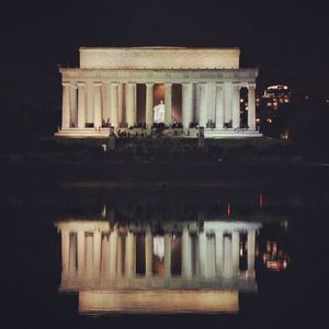 Built structure against sky at night