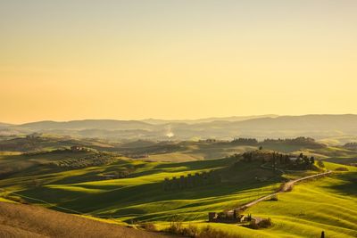 Scenic view of landscape against sky during sunset