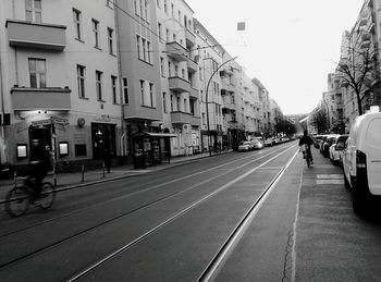 People on road in city