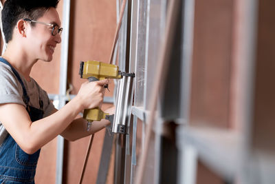 Side view of woman working