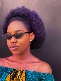 Portrait of young woman wearing sunglasses