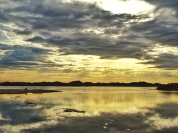 Scenic view of lake against sky during sunset