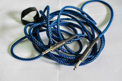 Close-up of blue cable on white background