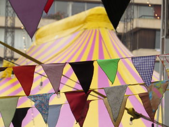 Close-up of multi colored flags hanging