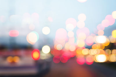 Defocused image of illuminated lights at night