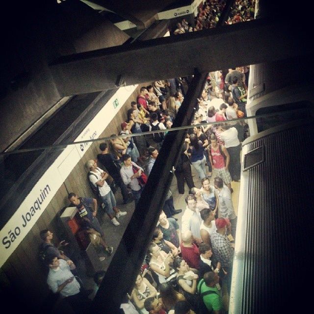 large group of people, men, person, indoors, crowd, market, high angle view, transportation, lifestyles, abundance, retail, shopping, hanging, occupation, consumerism, for sale, day, market stall, mixed age range