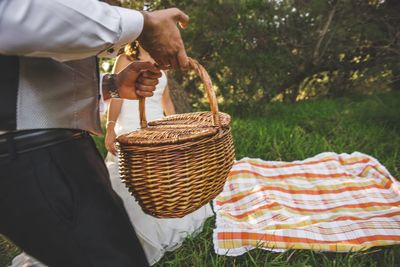 Midsection of man working in basket