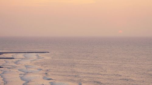 Scenic view of sea at sunset