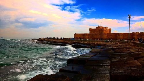 Scenic view of sea against cloudy sky