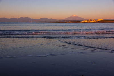 Scenic view of sea against sky at sunset