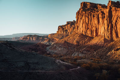 Rock formations on landscape against sky