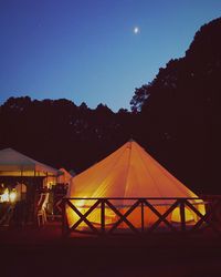 Silhouette of lamp post against clear sky at night