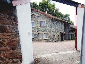 Houses in town against sky