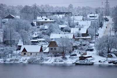 Aerial view of snow covered houses in town