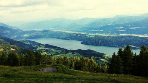 Scenic view of mountains against cloudy sky