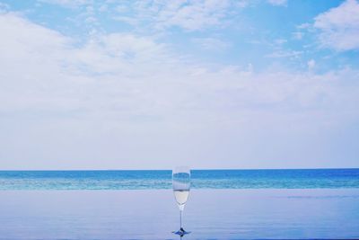 Scenic view of sea against blue sky