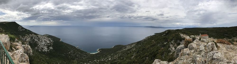 A panoramic view from the lubenice village towards lubenice beach in the middle.