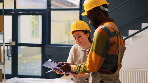 Side view of man working in workshop