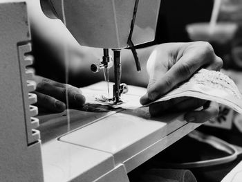 Close-up of person working on fabric