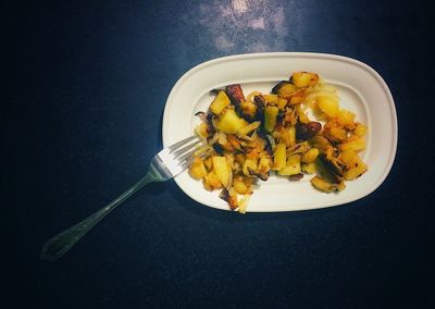 High angle view of fruits in plate on table