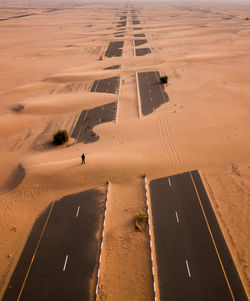 High angle view of man standing on desert