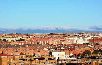 Aerial view of townscape against sky