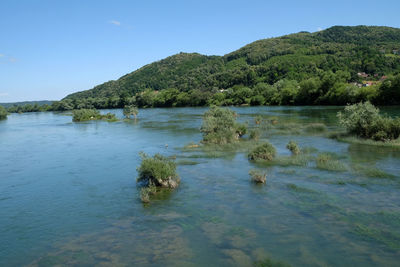 Scenic view of lake against blue sky