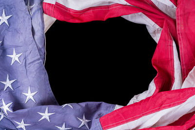 Close-up of flag against black background