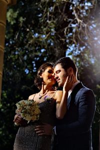 Portrait of a young couple with pink flower