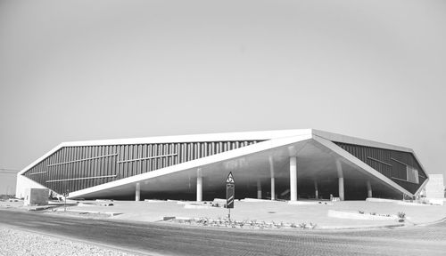 Built structure on beach against clear sky