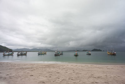 Sailboats on sea against sky