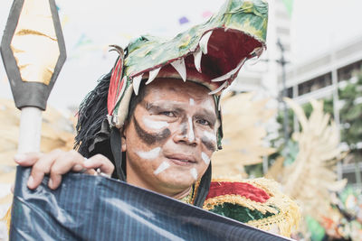 Portrait of woman wearing costume in traditional festival