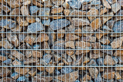 Full frame shot of logs against wall