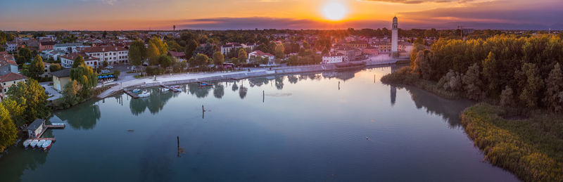 Drone aerial view of the casier harbour against sky at sunset