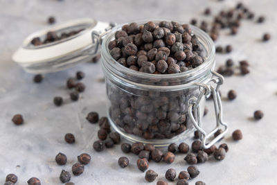 High angle view of coffee beans in jar on table