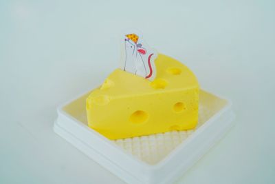 High angle view of cake on table against white background