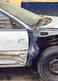 High angle view of damaged car on street