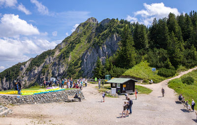 People on beach against sky