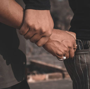 Cropped image of man hand holding hand