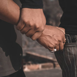 Close-up of man holding hands