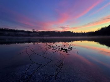 Scenic view of lake against sky during sunset