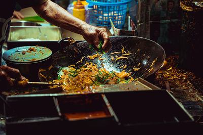 Midsection of person preparing food