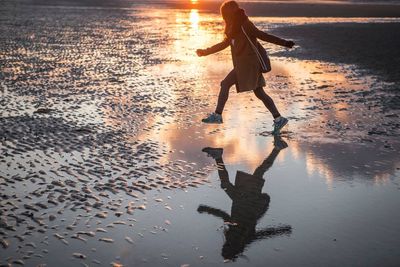 Reflection of woman in water