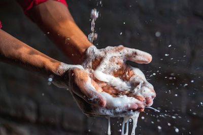 Cropped image of hand holding ice cream