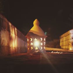 Close-up of illuminated lamp at night