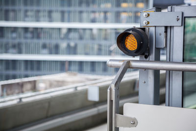 Close-up of lighting equipment on metal