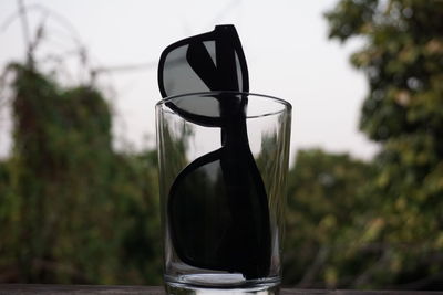 Close-up of glass bottle on table