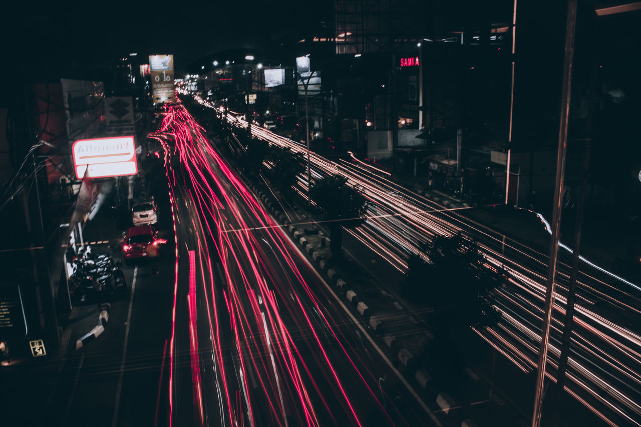 HIGH ANGLE VIEW OF LIGHT TRAILS ON CITY AT NIGHT