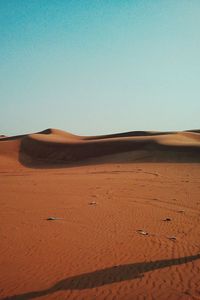 Scenic view of desert against clear sky